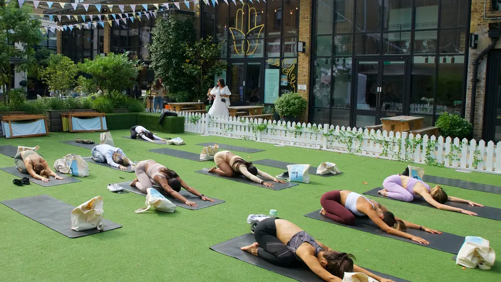 A group of women doing yoga in Eccleston Yards