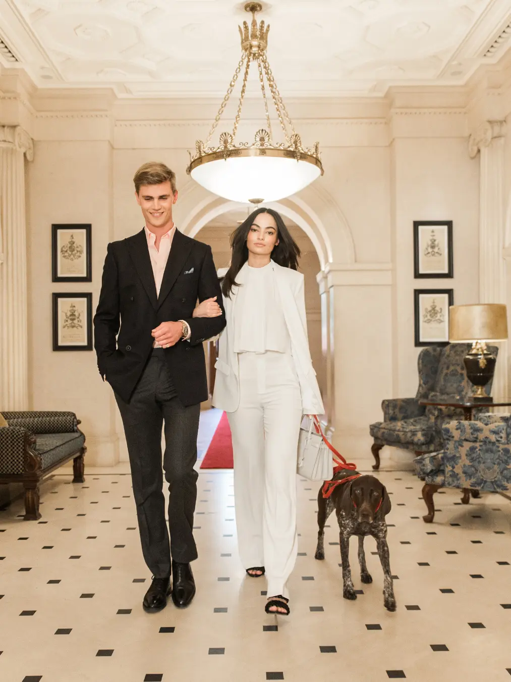 two people walking through lobby