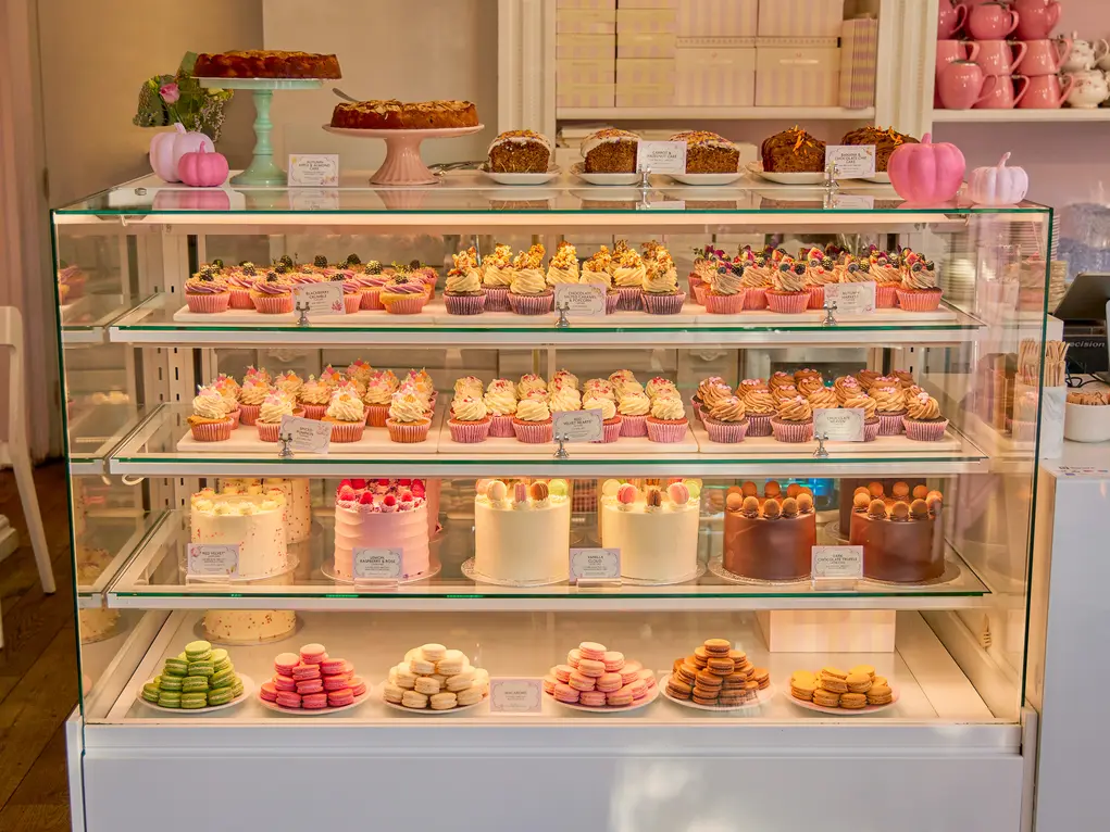 A fridge filled with cakes